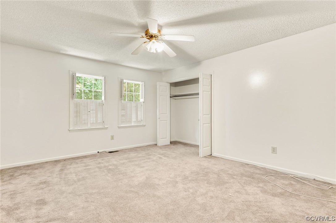 5158 Boydton Plank Road Brodnax, VA 23920 - Photo 12 of 43 an empty room with windows and fan