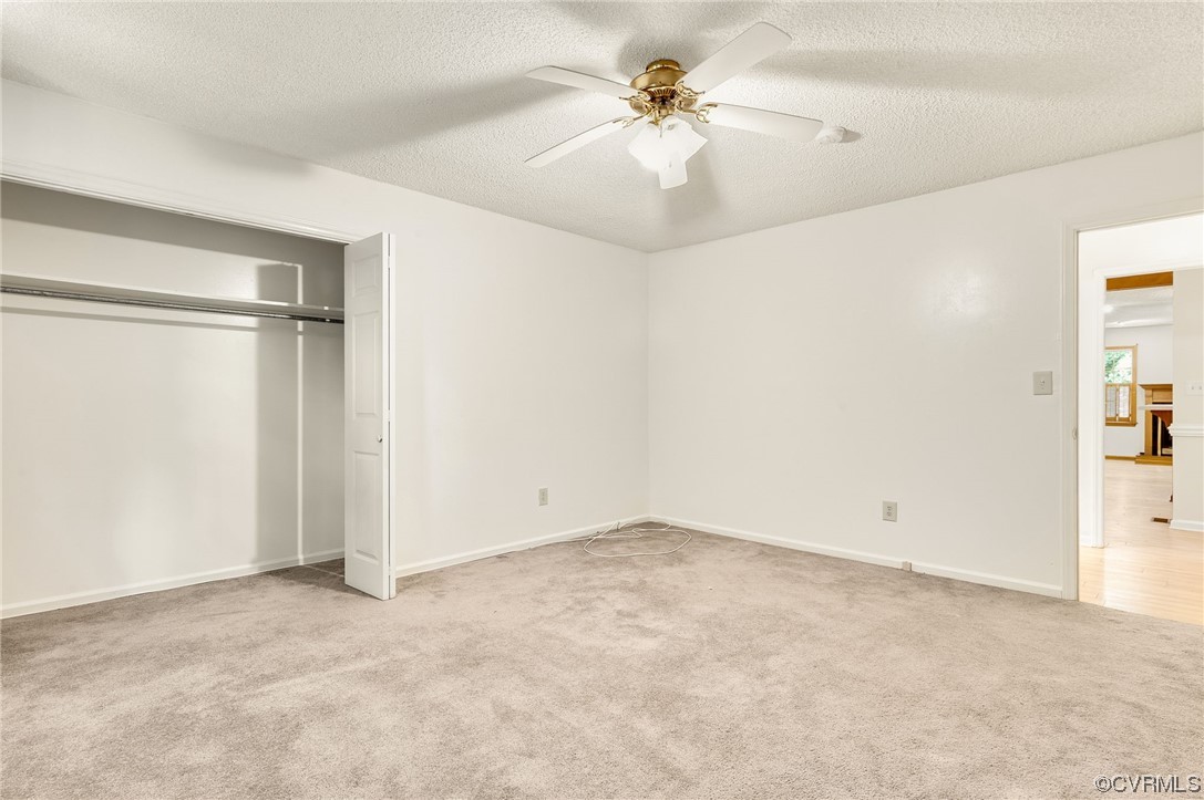 5158 Boydton Plank Road Brodnax, VA 23920 - Photo 13 of 43 an empty room with a ceiling fan and a window