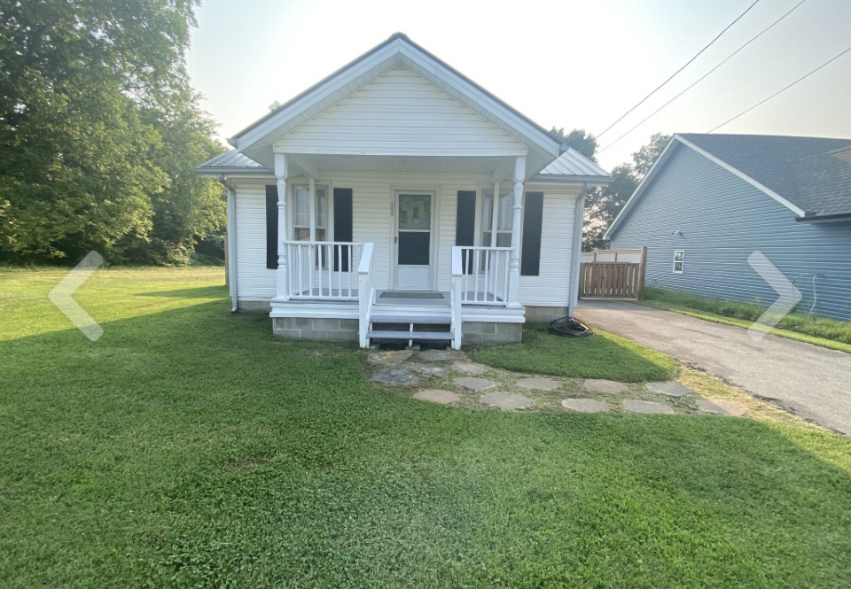 a front view of house with yard and porch
