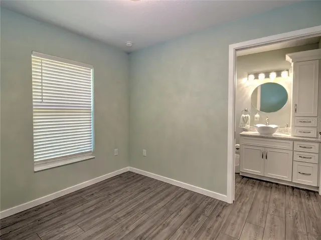 a bathroom with a glass shower door