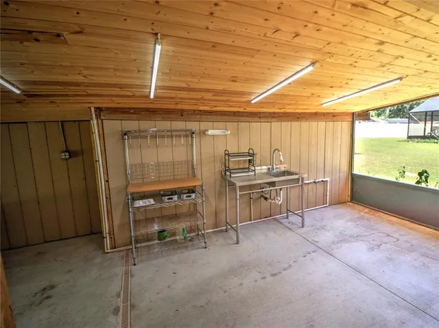 a view of a room with wooden floor and a window