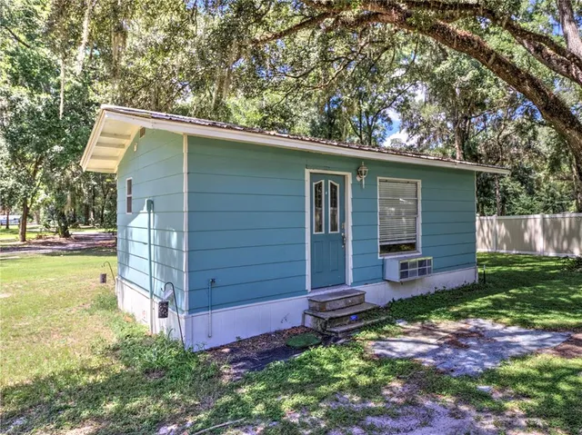 a view of a backyard with a tub