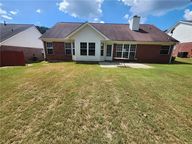 a front view of a house with yard
