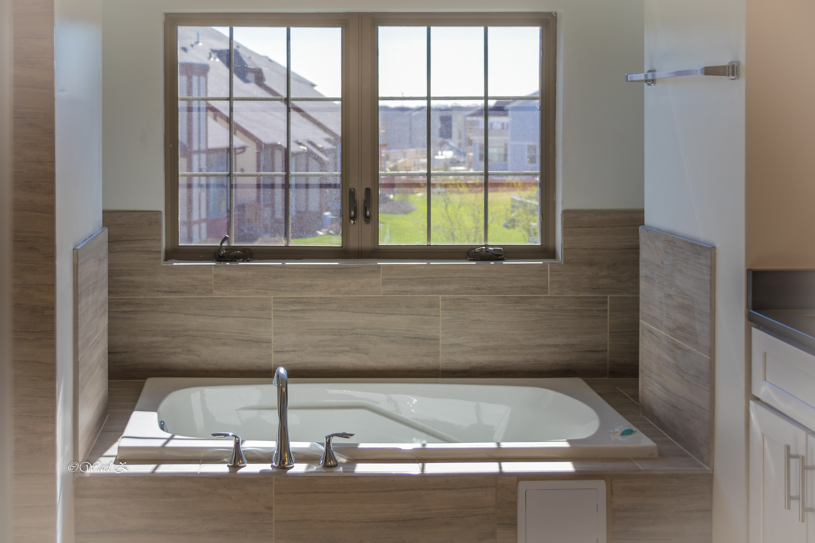 12728 Wild Rye Court, Unit B Plainfield, IL 60585 - Photo 13 of 21 a view of a bath tub sitting in a bathroom