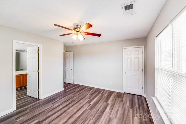 a bathroom with a sink a mirror and a shower