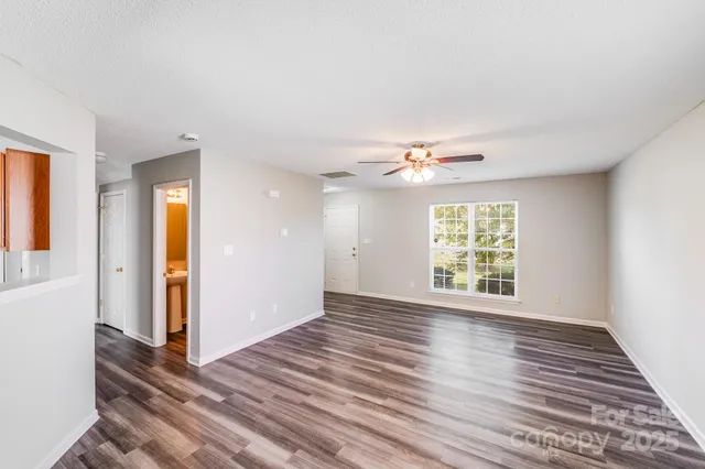 a kitchen with stainless steel appliances granite countertop a stove and a refrigerator
