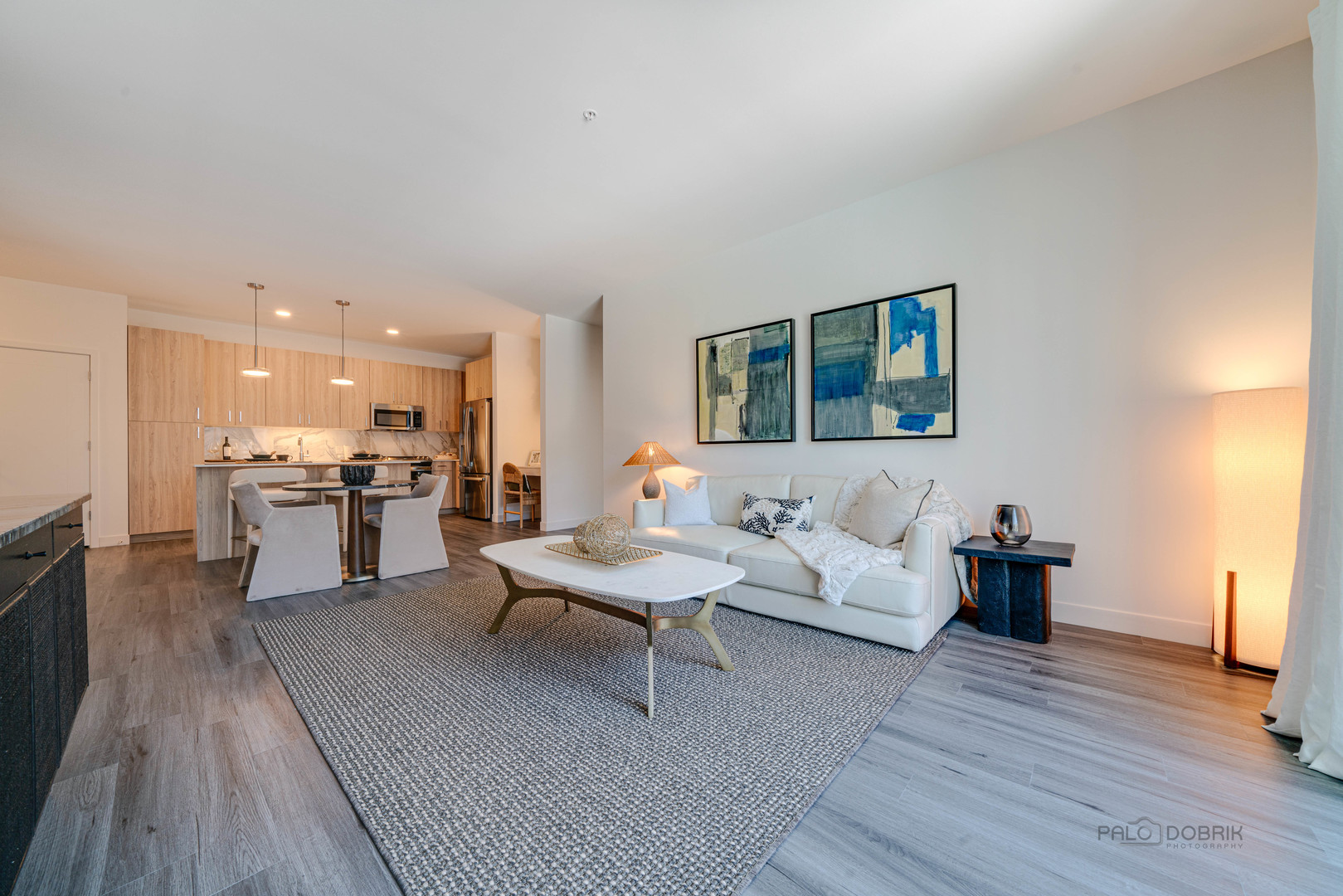 750 Hawthorn Row, Unit 1115 Vernon Hills, IL 60061 - Photo 15 of 24 a living room with furniture and kitchen view