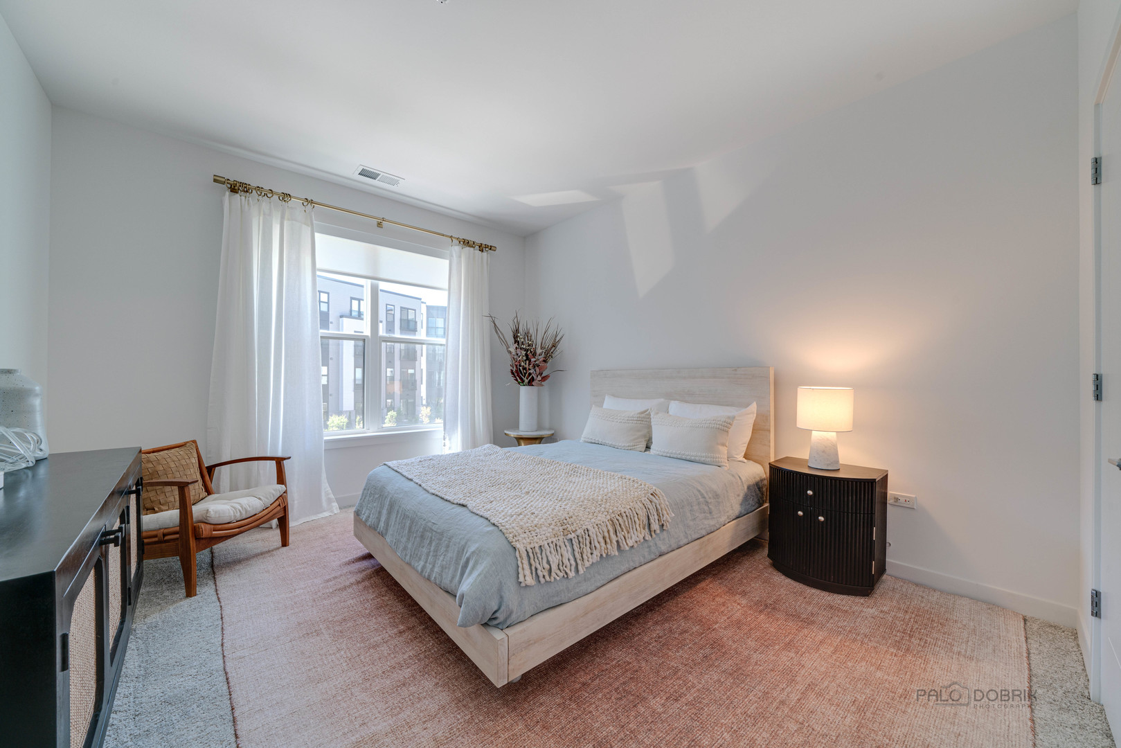 750 Hawthorn Row, Unit 1115 Vernon Hills, IL 60061 - Photo 19 of 24 a bedroom with a bed and a lamp on desk