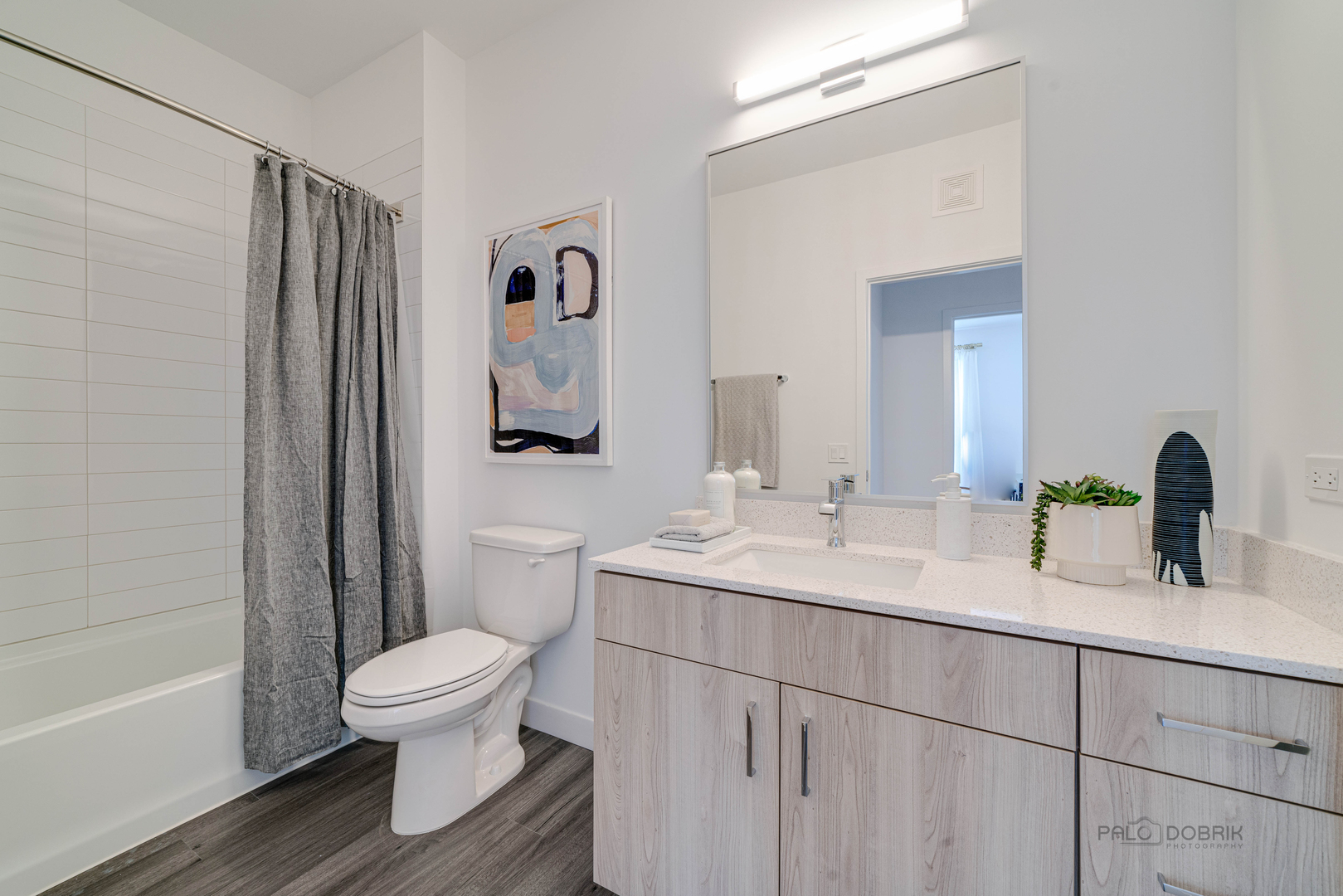 750 Hawthorn Row, Unit 1115 Vernon Hills, IL 60061 - Photo 20 of 24 a bathroom with a sink toilet and shower