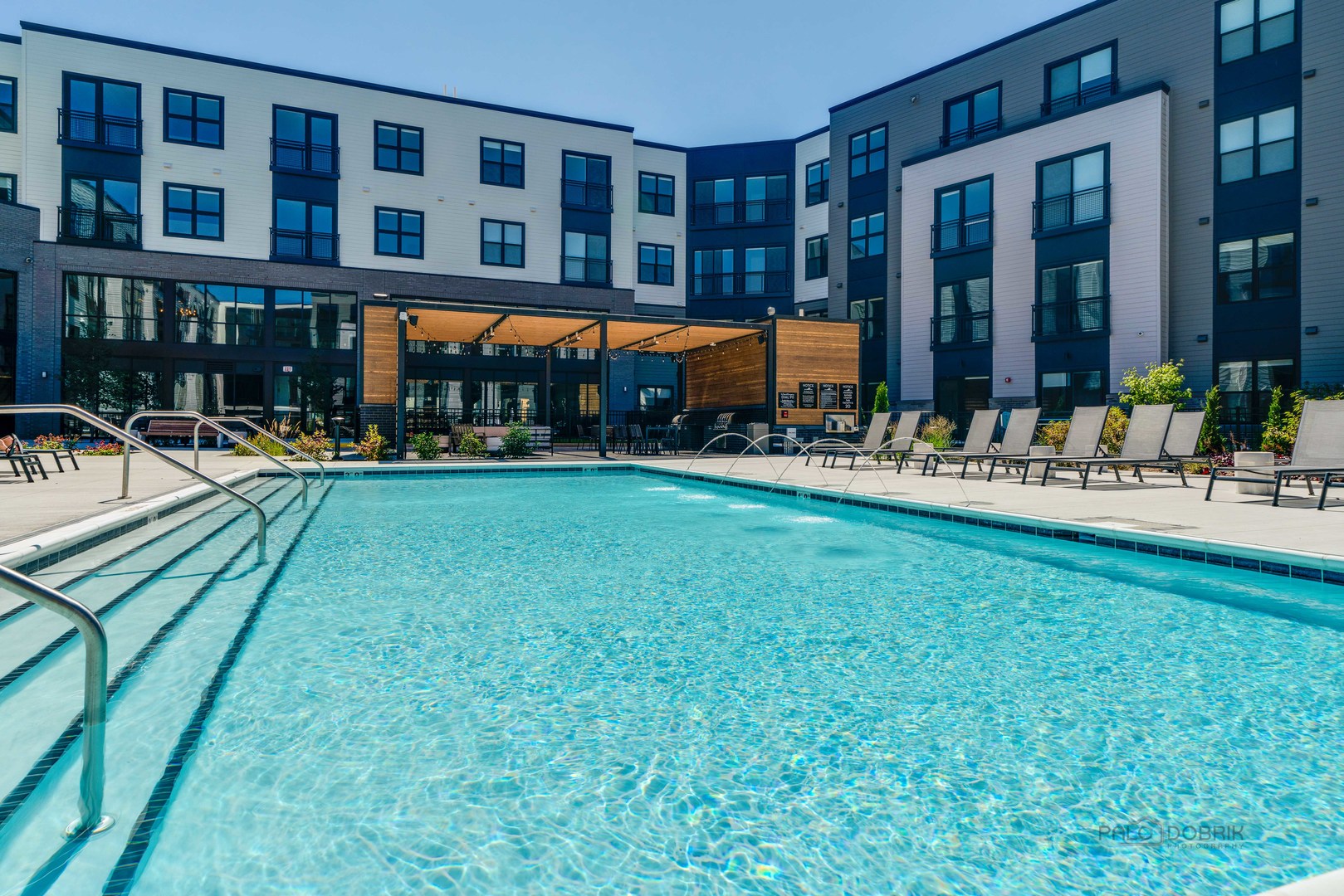 750 Hawthorn Row, Unit 1115 Vernon Hills, IL 60061 - Photo 24 of 24 a view of a building and a yard with chairs