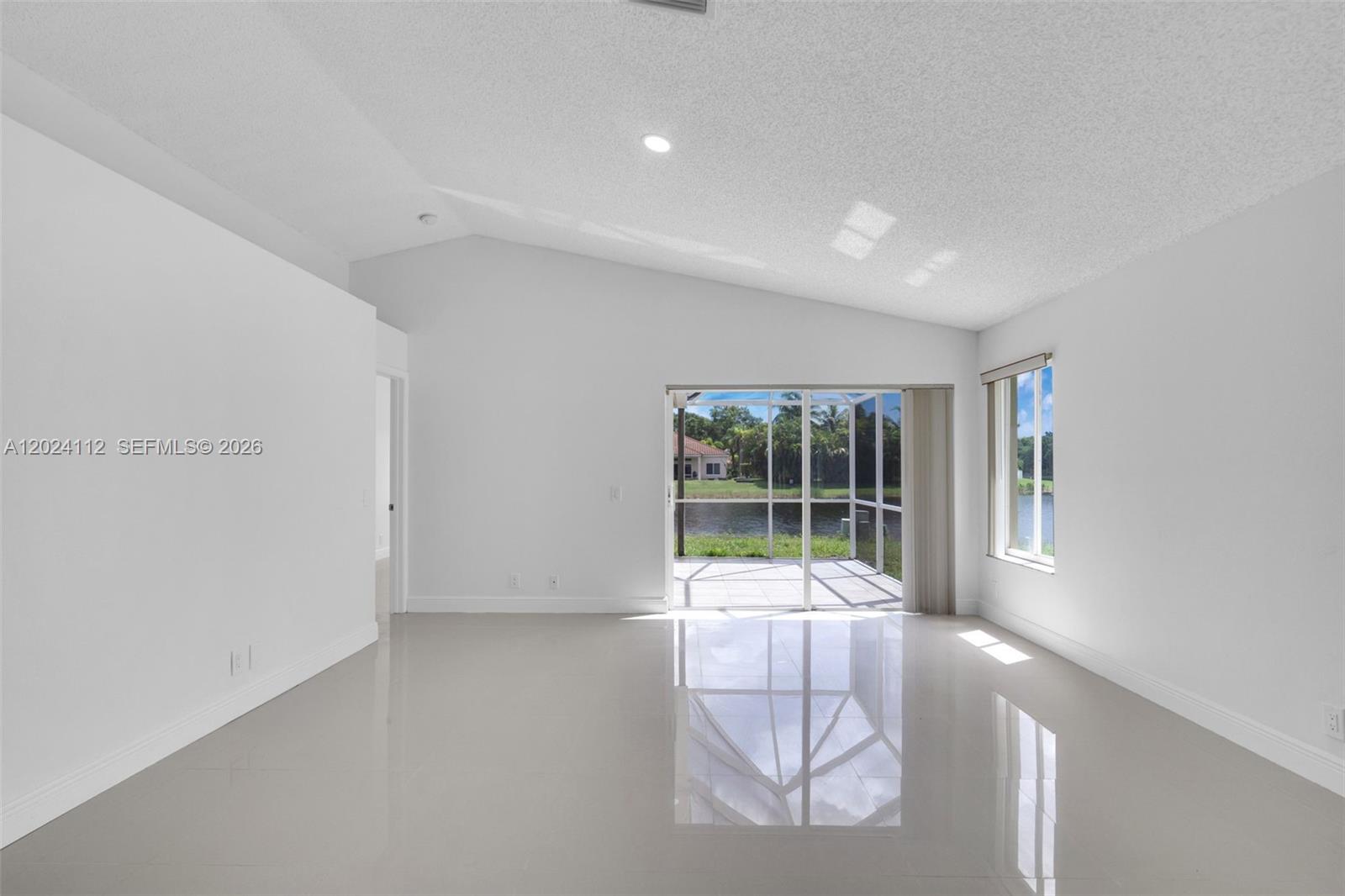 4366 Mahogany Ridge Drive Weston, FL 33331 - Photo 6 of 41 a living room with furniture and large windows