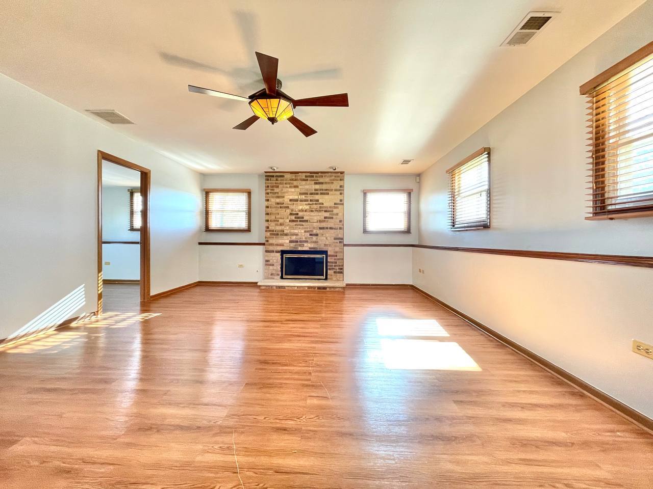 1689 Apple Valley Road Bolingbrook, IL 60490 - Photo 19 of 28 a view of empty room with wooden floor and fan