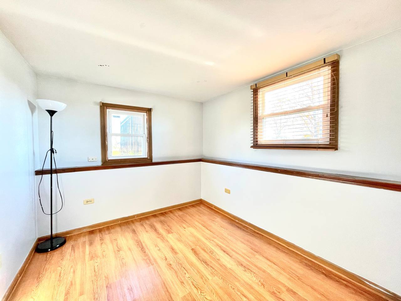 1689 Apple Valley Road Bolingbrook, IL 60490 - Photo 20 of 28 a view of a room with window and wooden floor
