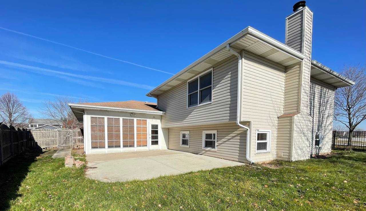 1689 Apple Valley Road Bolingbrook, IL 60490 - Photo 25 of 28 a front view of a house with a garden