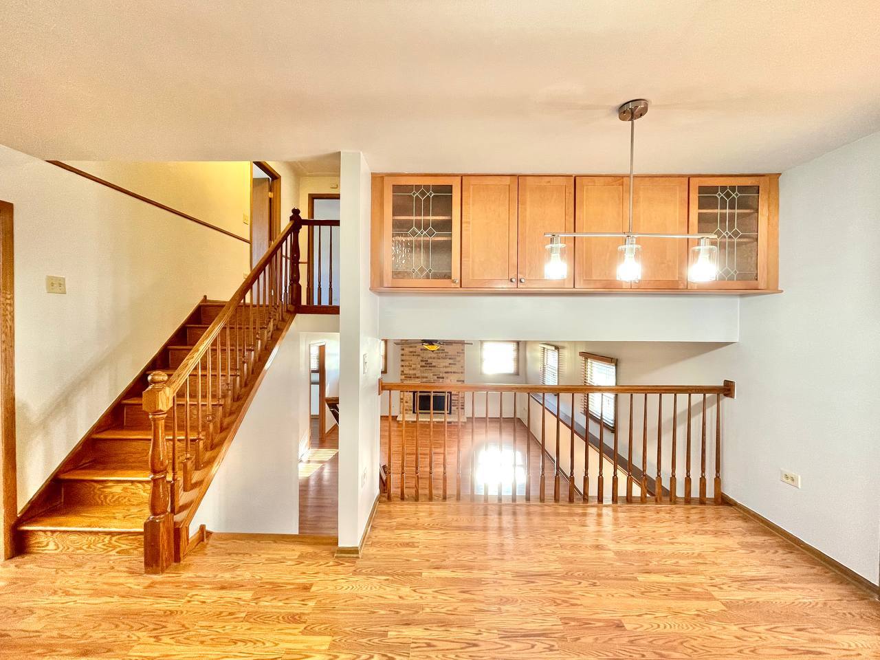 1689 Apple Valley Road Bolingbrook, IL 60490 - Photo 3 of 28 a view of an empty room with wooden floor