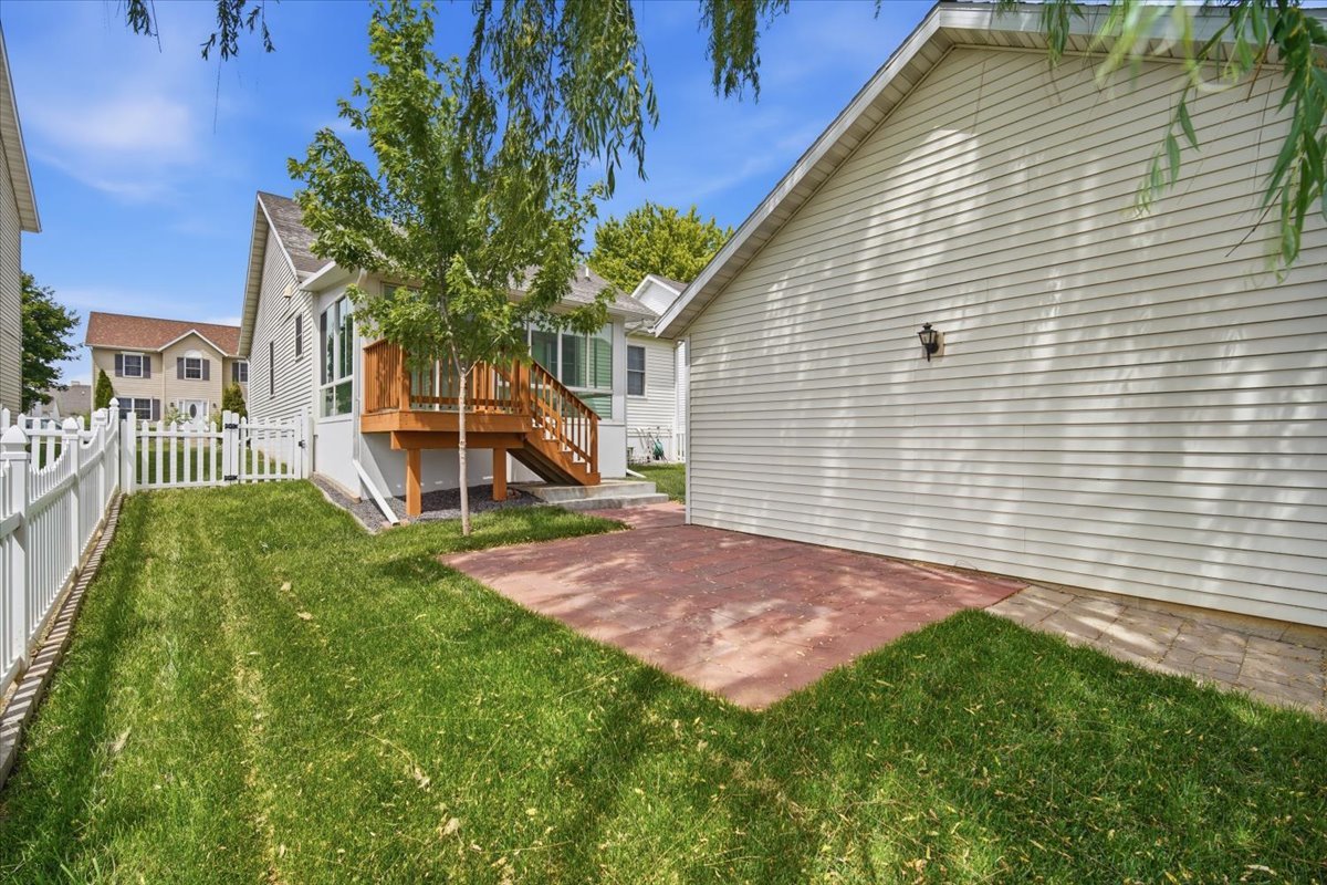 915 Teegan Street Normal, IL 61761 - Photo 31 of 33 a view of a backyard with a garden