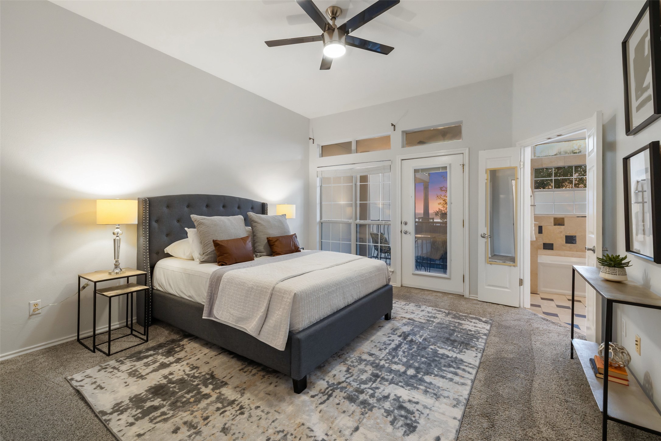 2918 Ranch To Market Road 620, Unit O282 Austin, TX 78734 - Photo 16 of 40 Bedroom featuring a ceiling fan, vaulted ceiling, access to outside, and carpet
