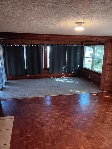 a view of a room with window and stairs