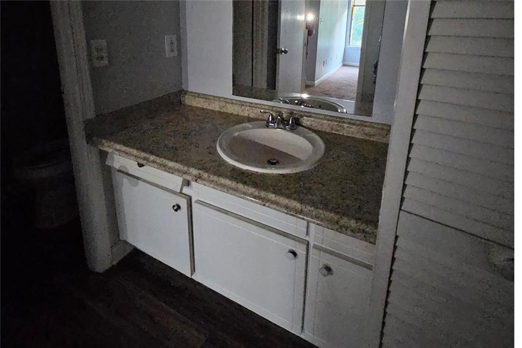 3575 Oakvale Road, Unit 420 Decatur, GA 30034 - Photo 13 of 13 a bathroom with a granite countertop sink and a mirror