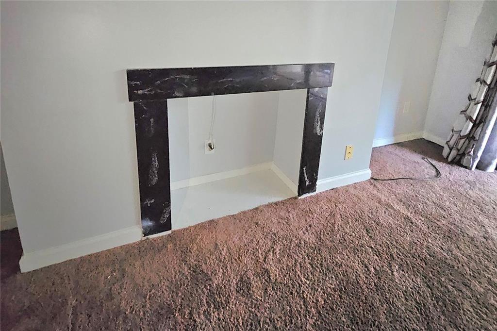 3575 Oakvale Road, Unit 420 Decatur, GA 30034 - Photo 5 of 13 a bedroom with a bed and wooden floor