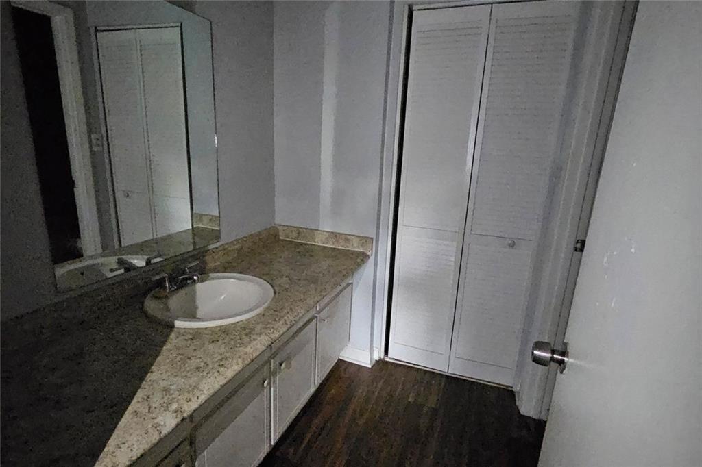 3575 Oakvale Road, Unit 420 Decatur, GA 30034 - Photo 8 of 13 a bathroom with a granite countertop sink and a mirror