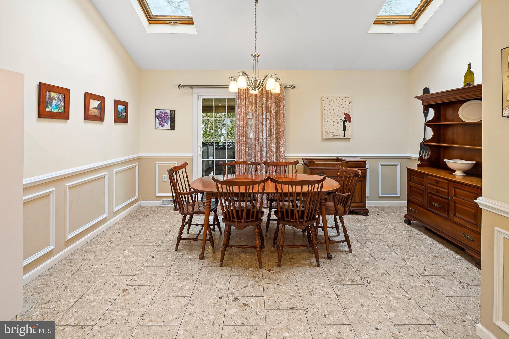 45 Pasadena Drive Hamilton, NJ 08619 - Photo 12 of 34 Newer sliding glass doors open to the patio