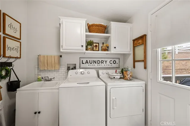 a kitchen with stainless steel appliances a stove a sink and a refrigerator