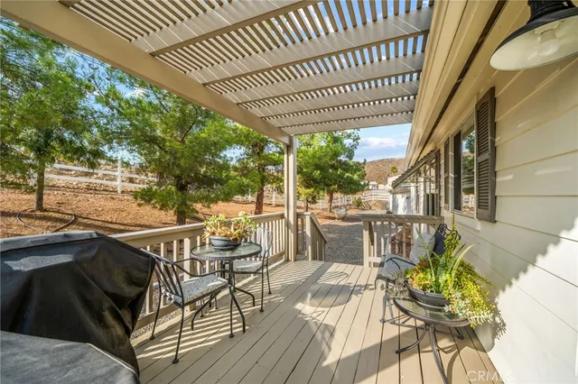 a view of a chairs and table in the balcony