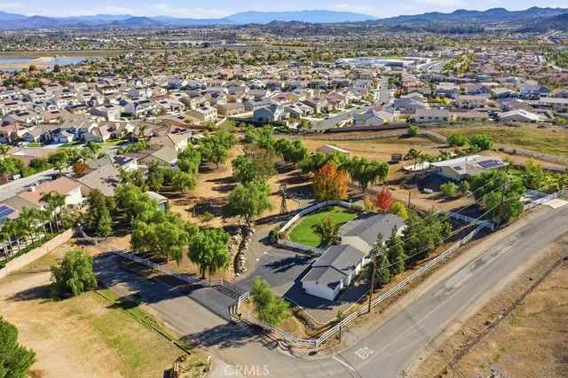 an aerial view of residential houses with outdoor space and river