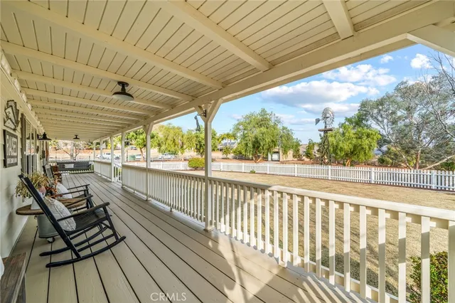 a view of a patio with wooden floor