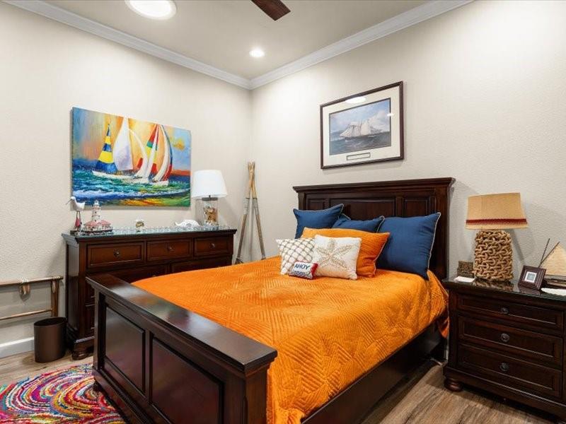 3510 Fountain Way Granbury, TX 76049 - Photo 11 of 27 Bedroom with ornamental molding, light wood-style floors, a textured wall, a ceiling fan, and recessed lighting