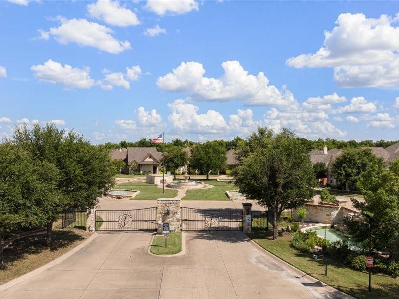 3510 Fountain Way Granbury, TX 76049 - Photo 23 of 27 Surrounding community with a gate and driveway