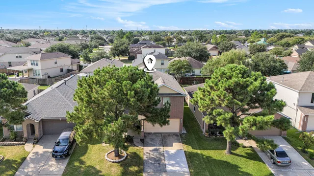 an aerial view of residential houses with outdoor space