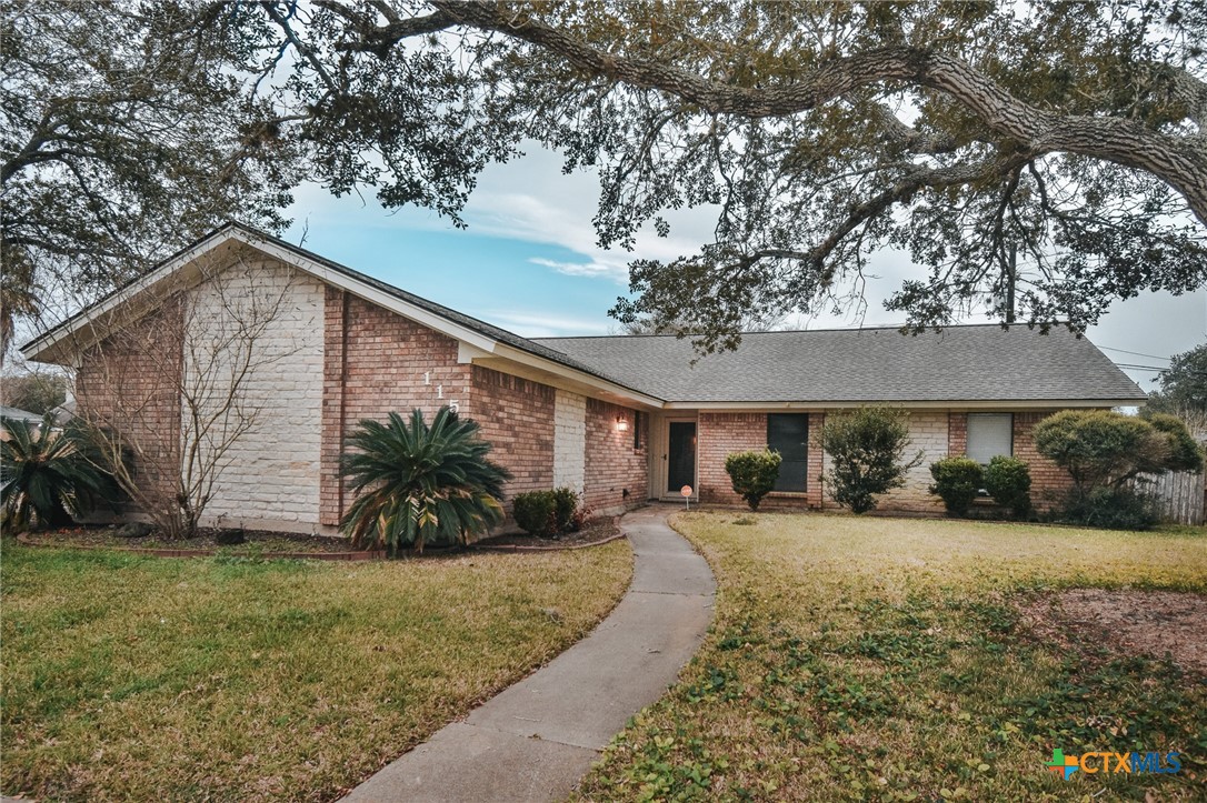 115 Santa Fe Victoria, TX 77904 - Photo 1 of 17 a front view of a house with a yard