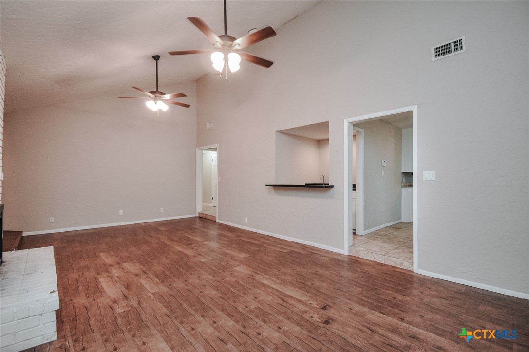 115 Santa Fe Victoria, TX 77904 - Photo 10 of 17 a view of an empty room with a chandelier fan