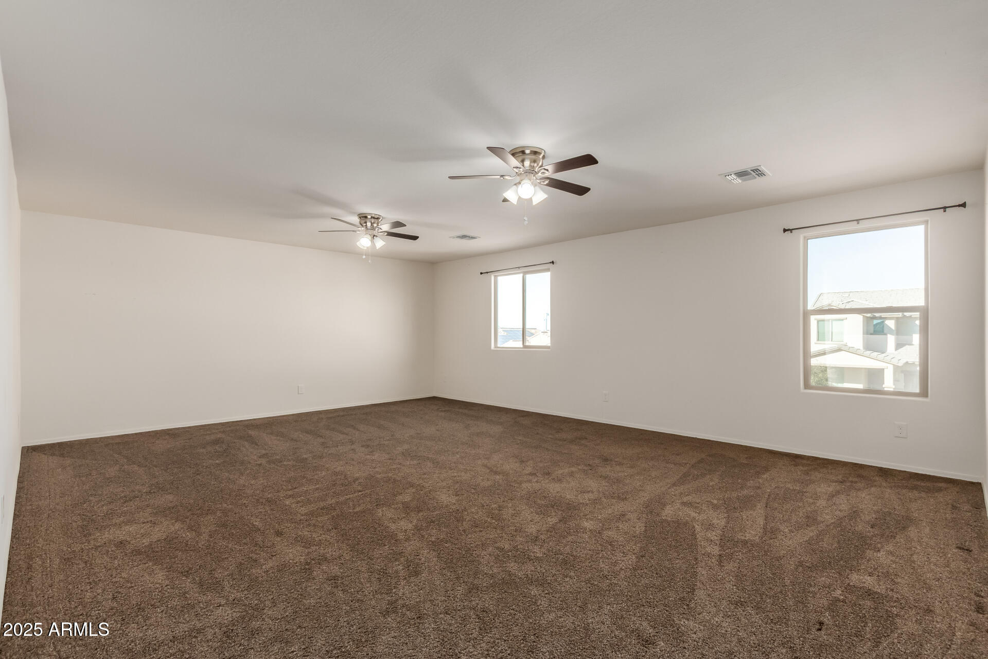 11603 West Calavar Road El Mirage, AZ 85335 - Photo 11 of 38 a view of an empty room with a window