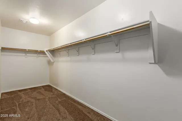 a view of an empty walk in closet