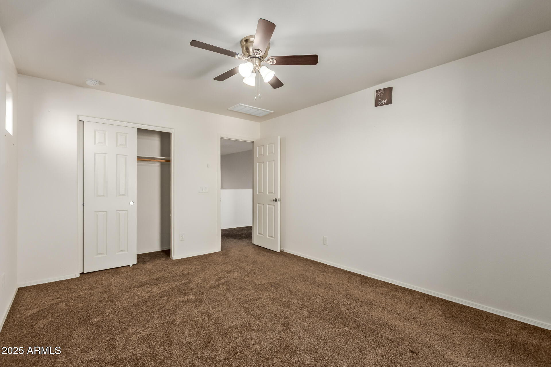 11603 West Calavar Road El Mirage, AZ 85335 - Photo 22 of 38 a view of an empty room