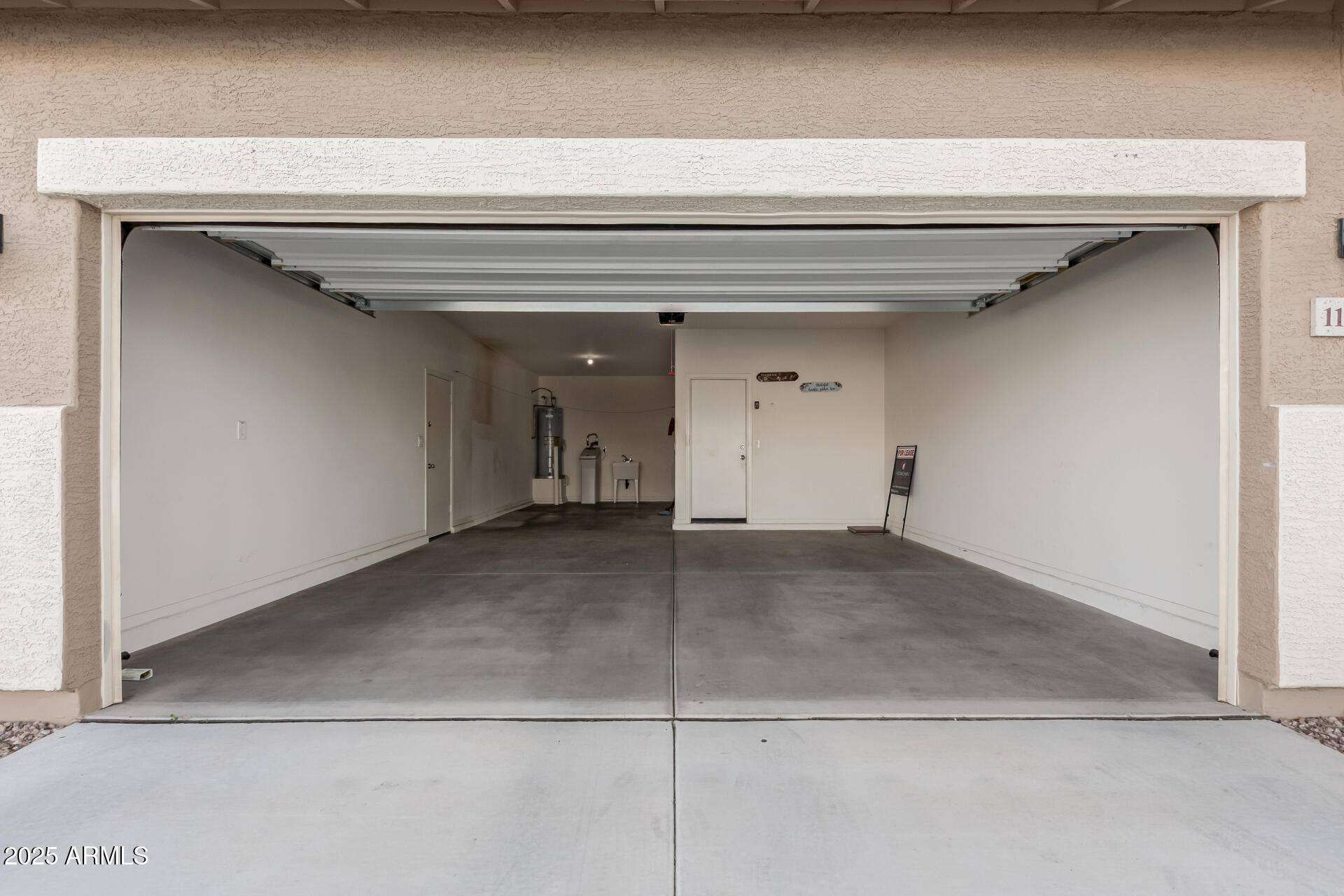 11603 West Calavar Road El Mirage, AZ 85335 - Photo 25 of 38 a view of a garage