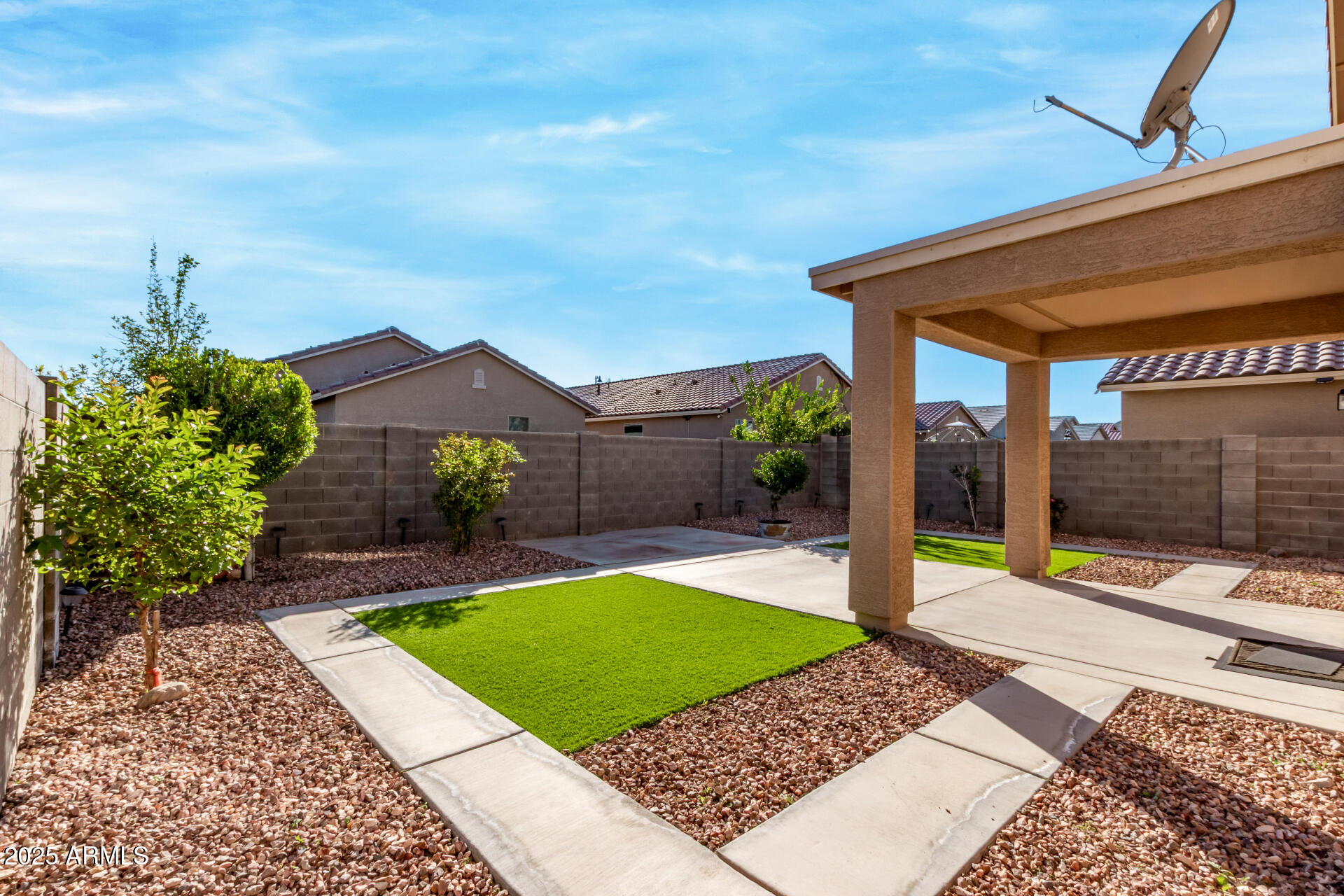 11603 West Calavar Road El Mirage, AZ 85335 - Photo 3 of 38 a view of a backyard with a patio