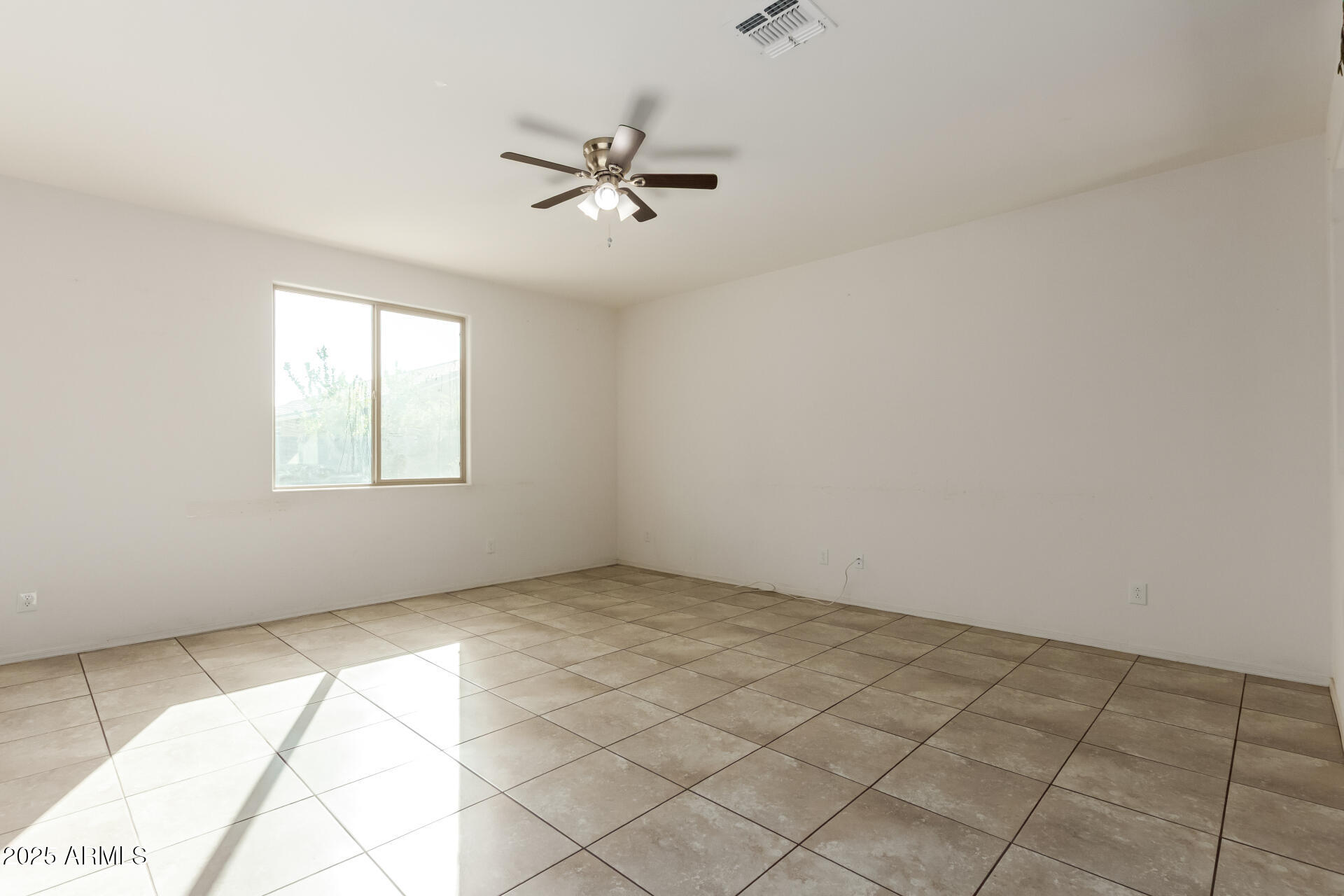 11603 West Calavar Road El Mirage, AZ 85335 - Photo 36 of 38 a view of an empty room with a window