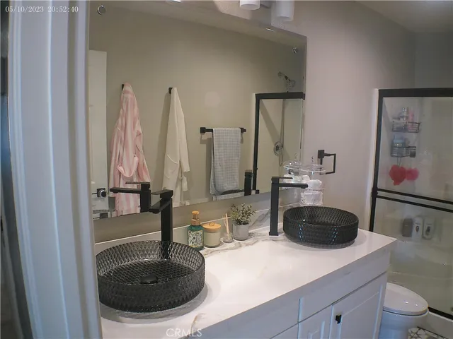 a bedroom with a bed and a lamp