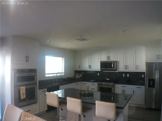 a view of entryway and hall with a front door