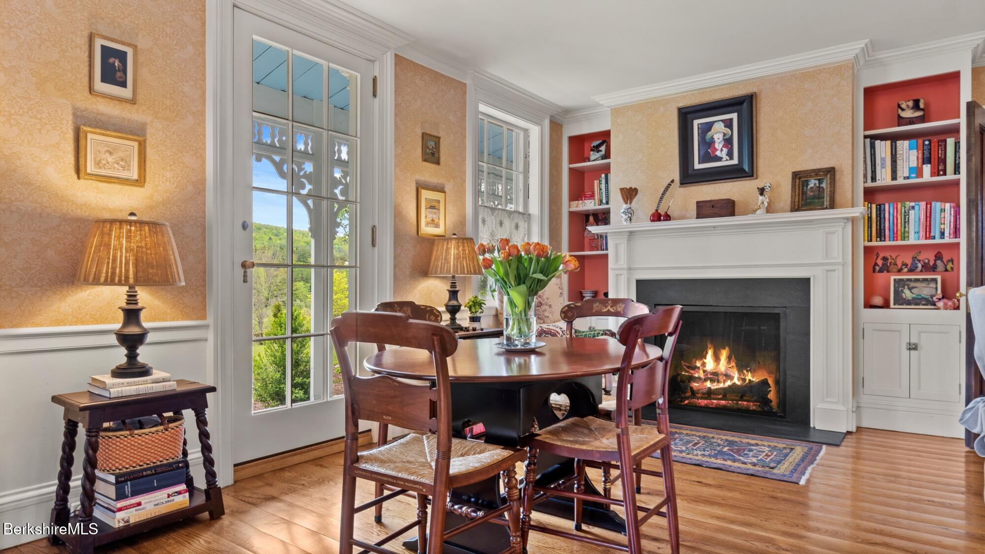 2650 Swamp Road Richmond, MA 01254 - Photo 11 of 49 a dining room with furniture and a fireplace