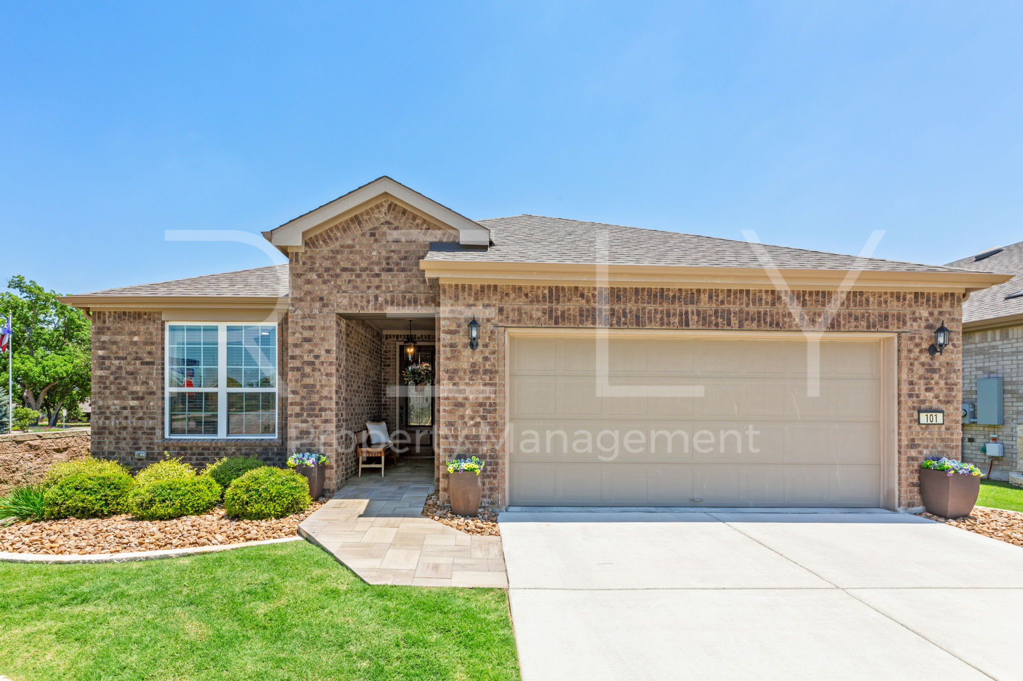 101 Spanish Star Street Georgetown, TX 78633 - Photo 1 of 39 A neatly manicured lawn frames this welcoming brick facade, complete with an attached garage and a charming front entryway.