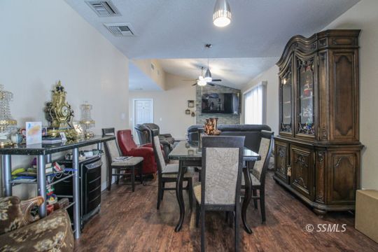 900 North Sierra View Street Ridgecrest, CA 93555 - Photo 19 of 42 a view of a dining room with furniture and wooden floor