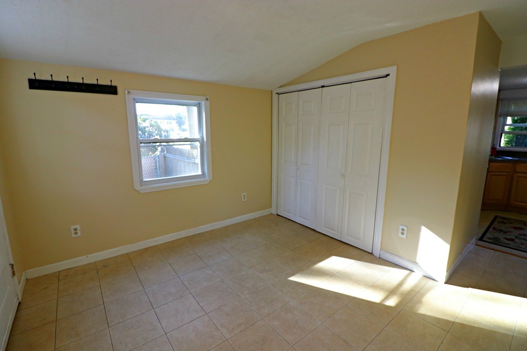 471 Plumtree Road Springfield, MA 01118 - Photo 8 of 15 a view of an empty room with a window