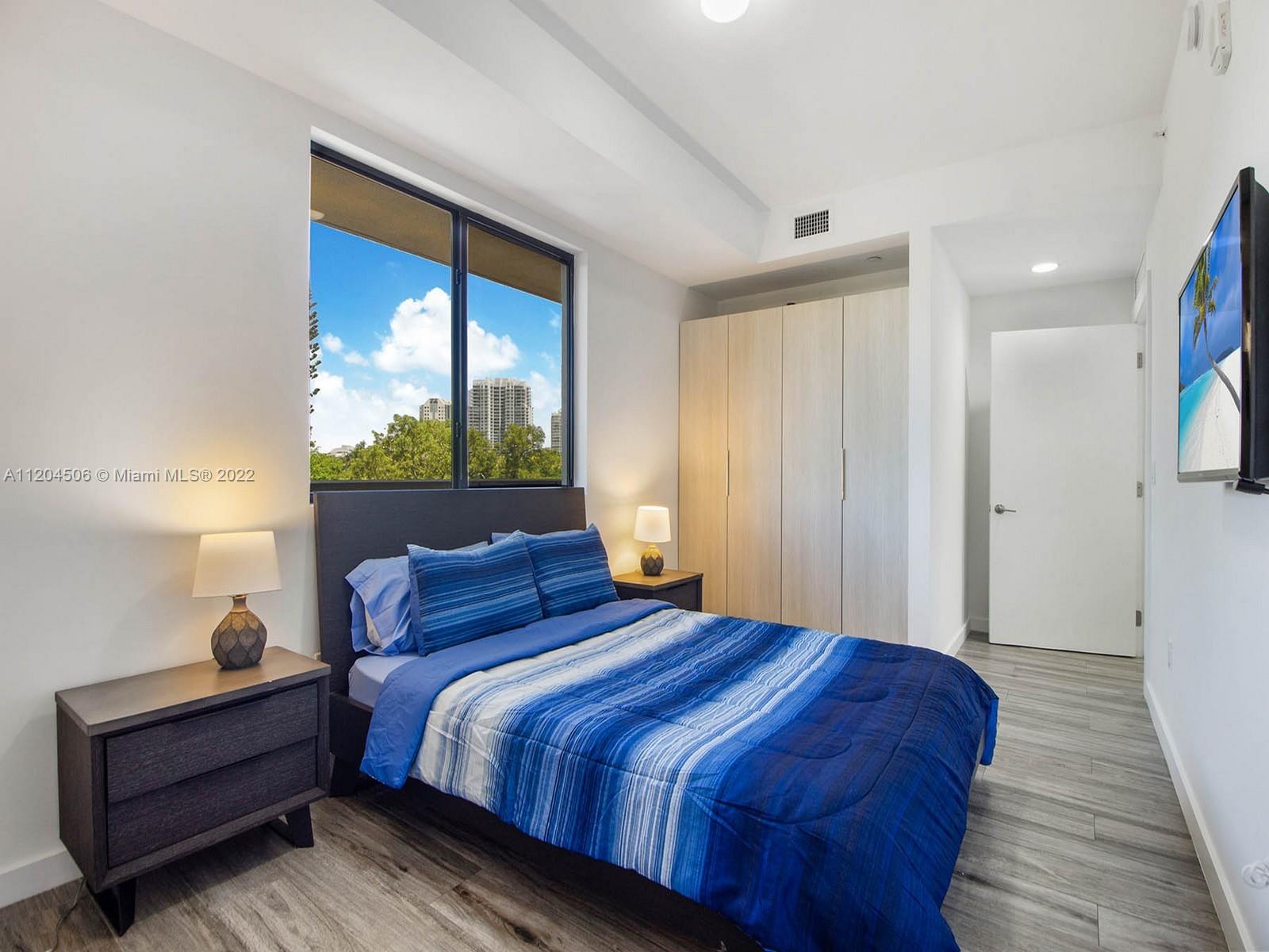 2955 Bird Avenue, Unit PHA Miami, FL 33133 - Photo 22 of 33 a bedroom with a bed and a window