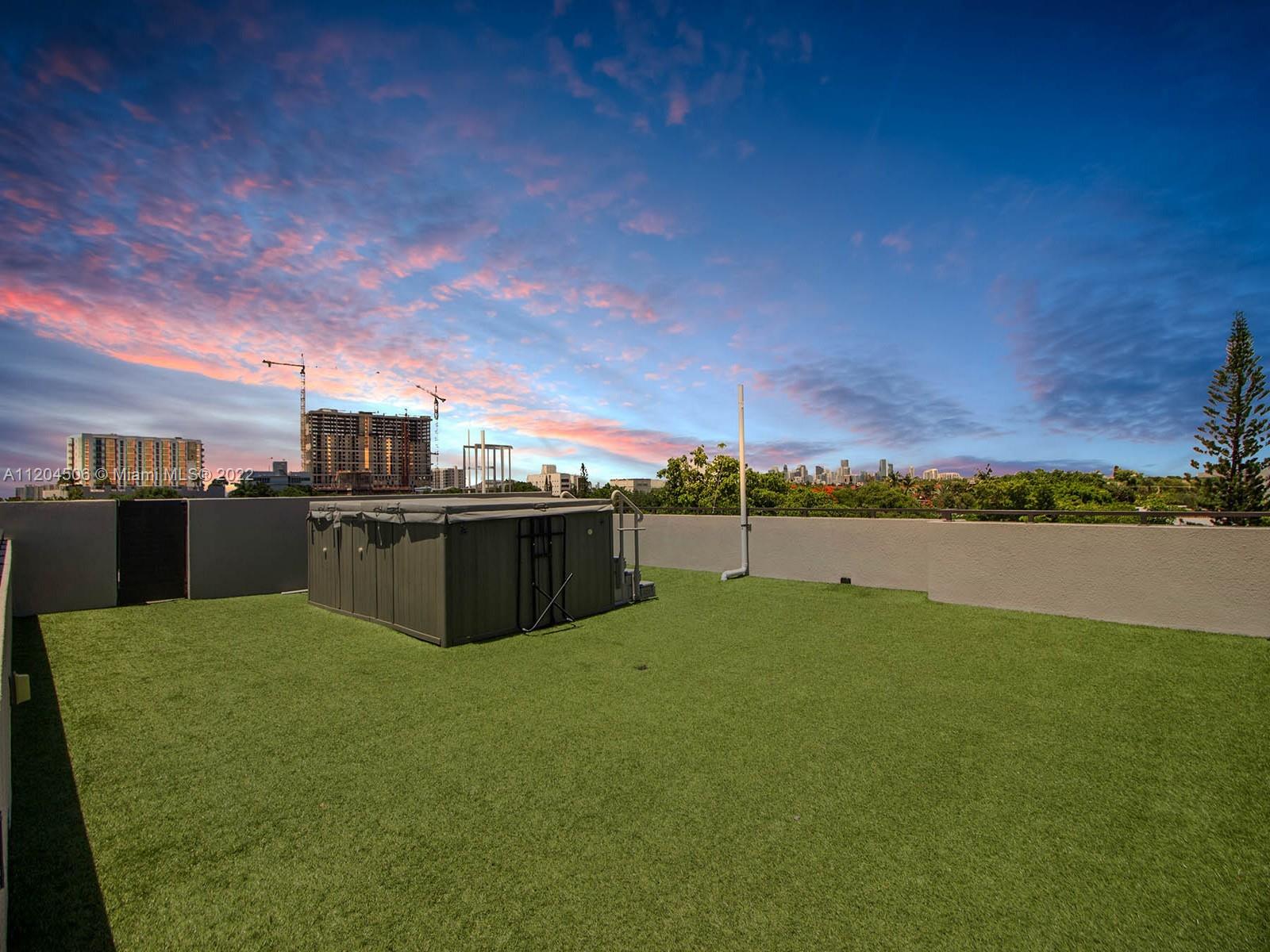 2955 Bird Avenue, Unit PHA Miami, FL 33133 - Photo 32 of 33 a view of a swimming pool with an outdoor seating