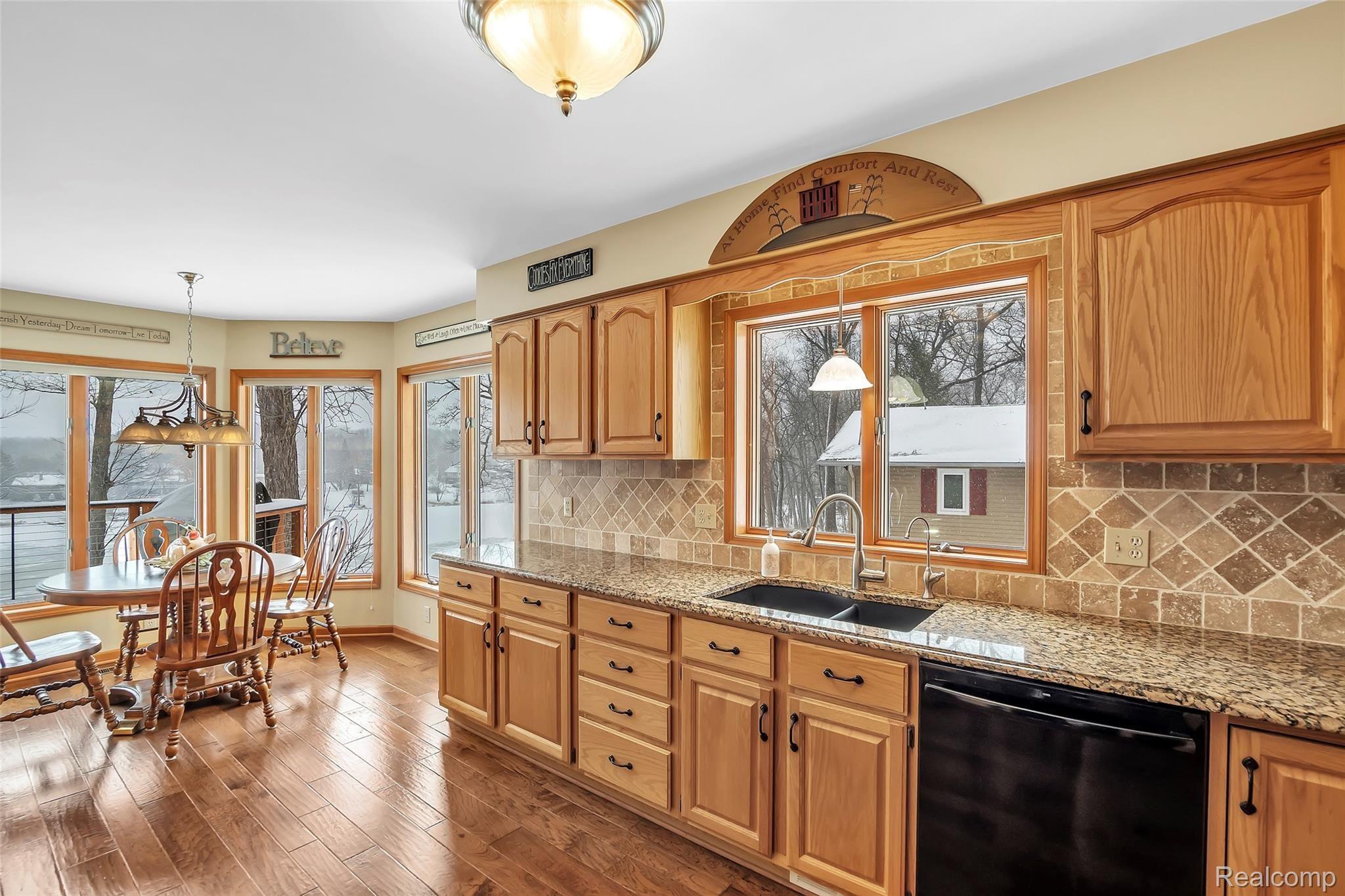 13413 White Lake Road Fenton, MI 48430 - Photo 9 of 27 Kitchen with Oak Cabinets, undercounter sink, granite, reverse osmosis and more!